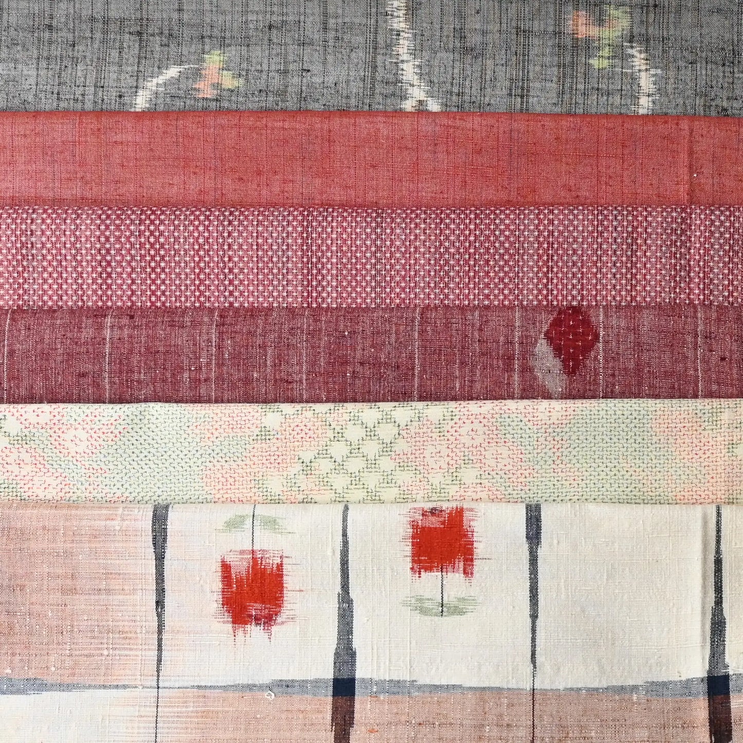 Set of six vintage kimono fabric pieces in soft red tone, perfect for patchwork and craft project.