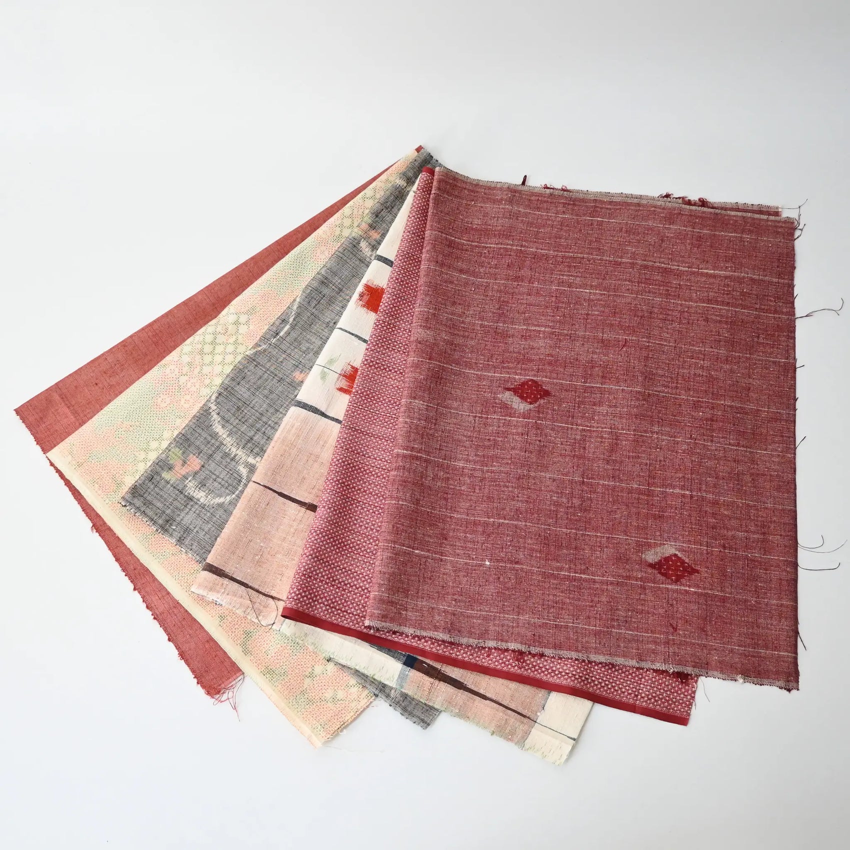 Set of six vintage kimono fabric pieces in soft red tone, perfect for patchwork and craft project.