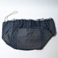 A rare vintage Japanese komebukuro, a traditional drawstring cotton rice bag hand pieced from a variety of indigo cottons.