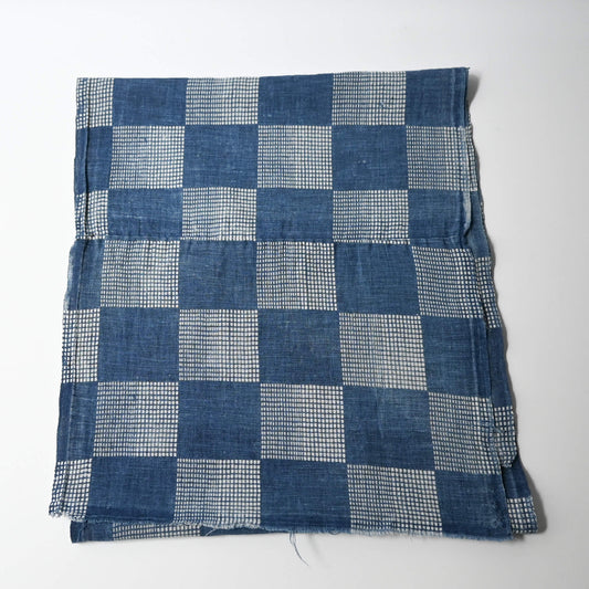 Full view of vintage lightweight soft indigo cotton piece from an old kimono with a large chequered design.