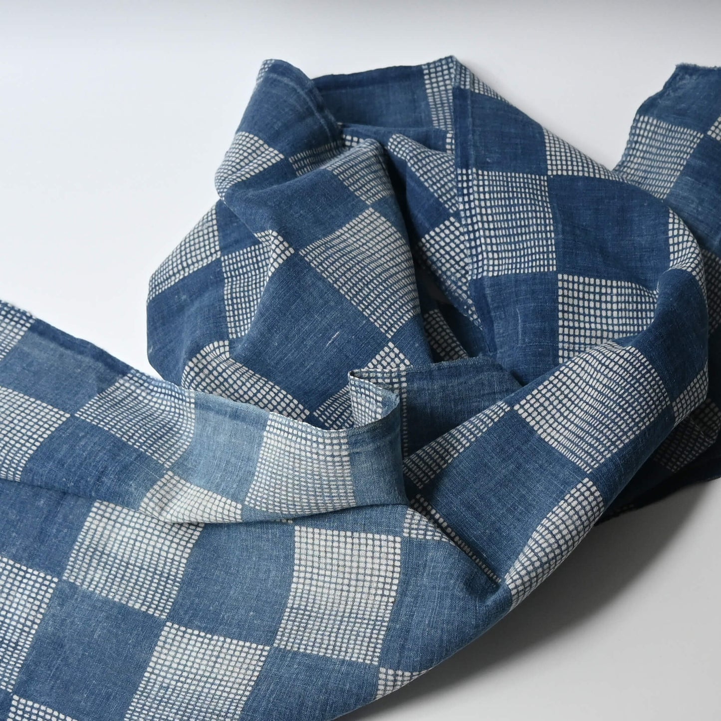 Vintage lightweight soft indigo cotton piece from an old kimono with a large chequered design.
