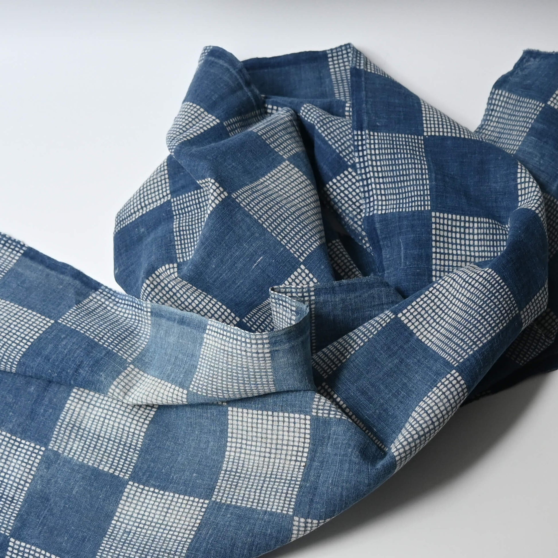 Vintage lightweight soft indigo cotton piece from an old kimono with a large chequered design.
