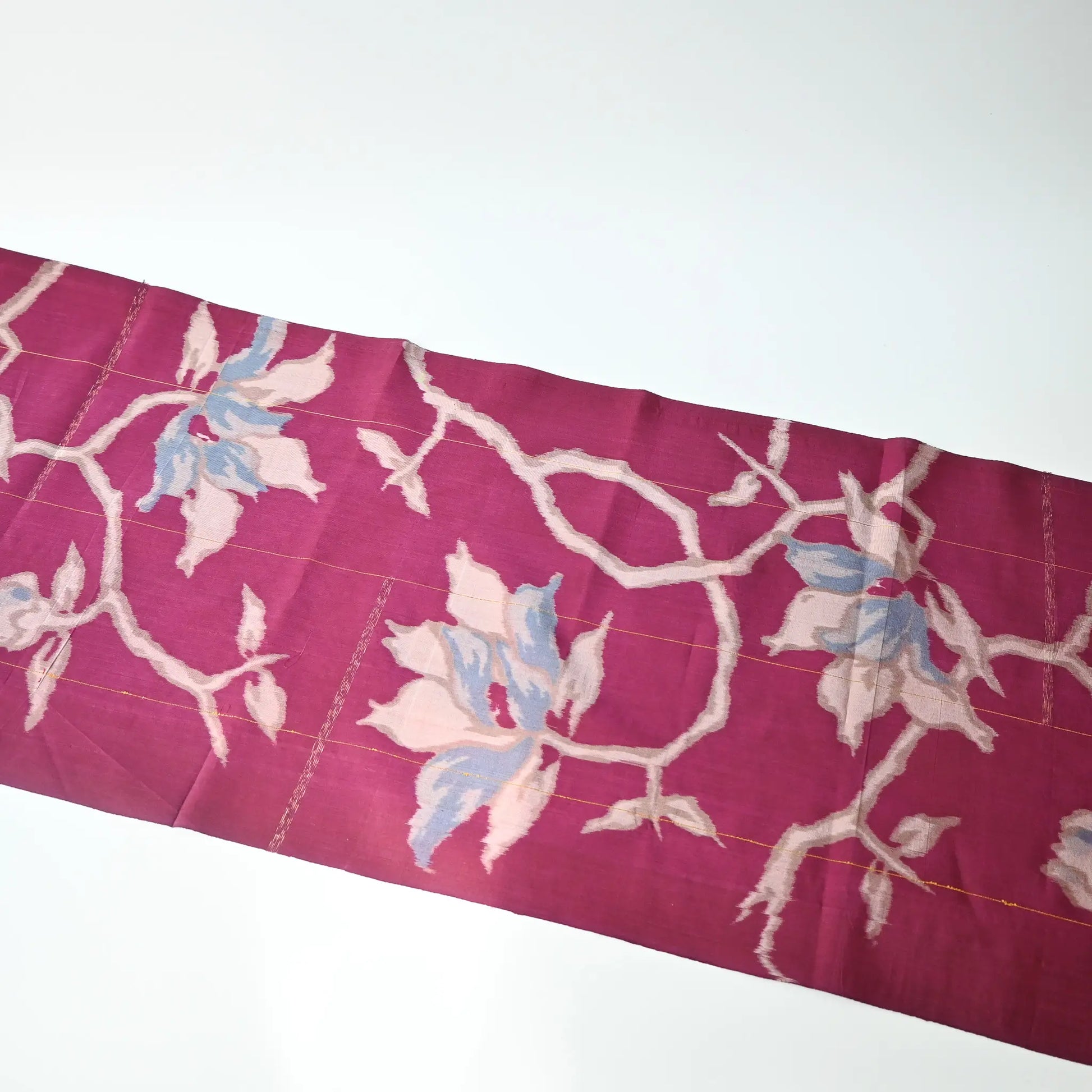 Full view of vintage Meisen kimono silk fabric, magenta colour with light blue bold floral pattern.