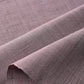 Close-up view of vintage Japanese slub textured tsumugi silk kimono fabric piece in dusty mauve tone.