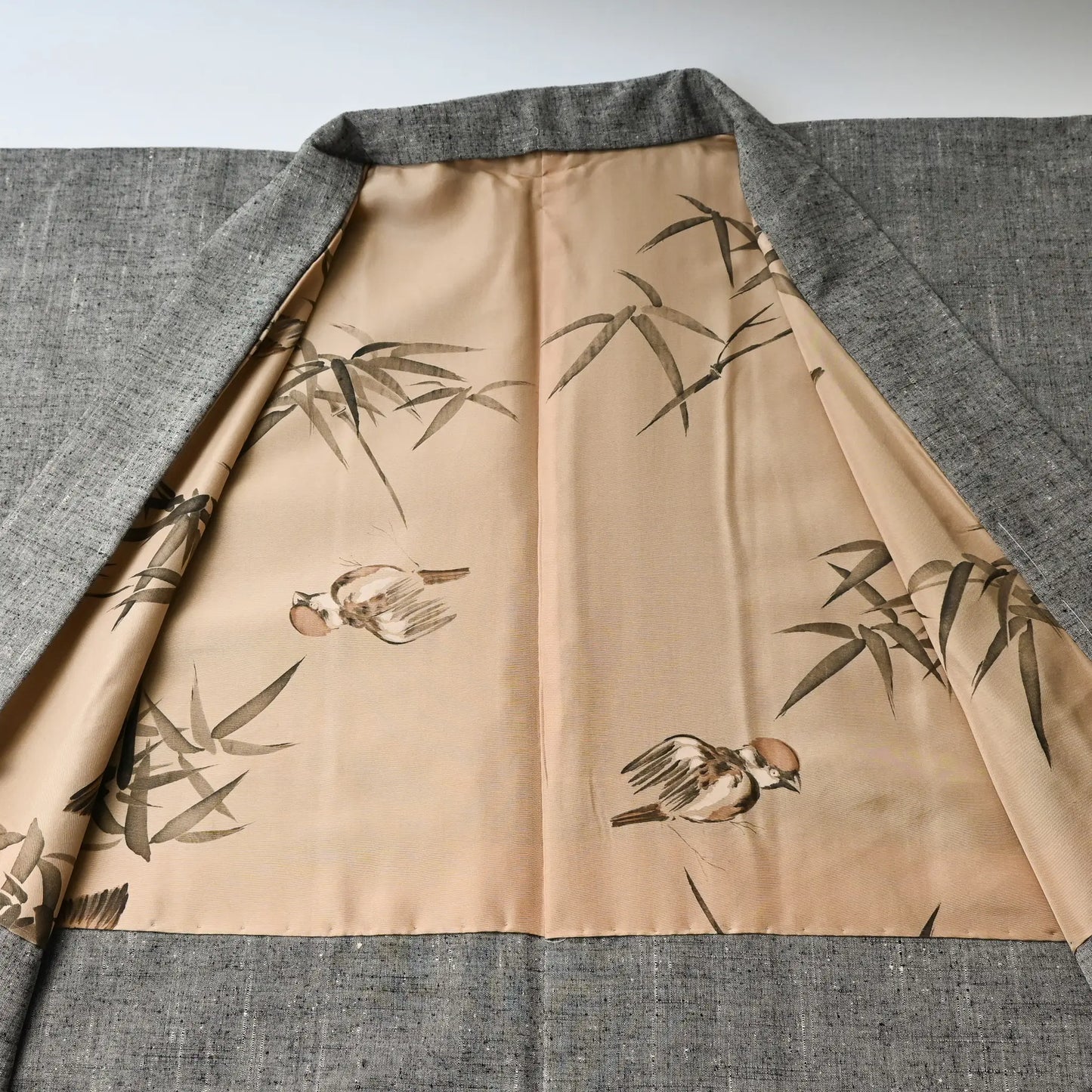 Vintage men's grey tsumugi silk haori with hand-painted lining. bamboo and sparrow.