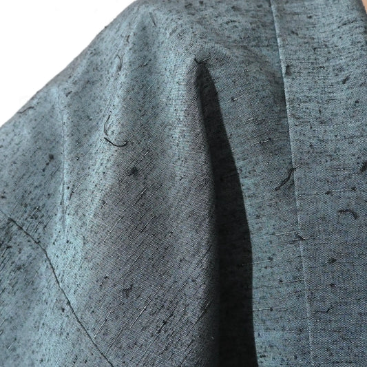 Detailed view of Vintage men's teal blue hige-tsumugui silk haori.