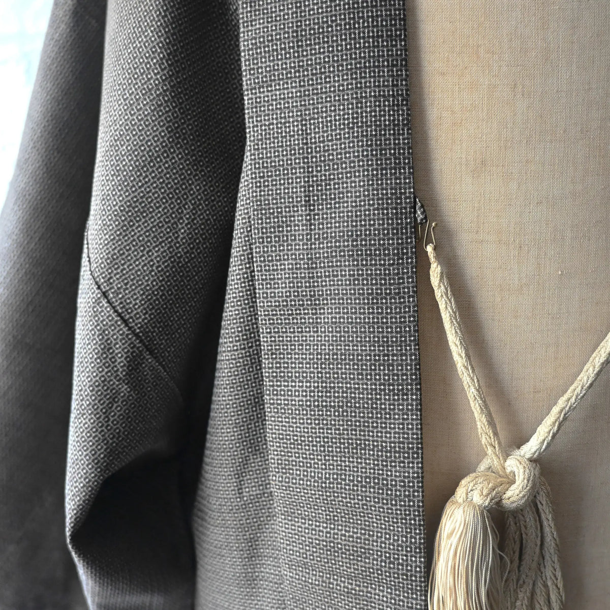 Close-up view of vintage Japanese men's silk haori with rare hand-painted Shunga on the lining.