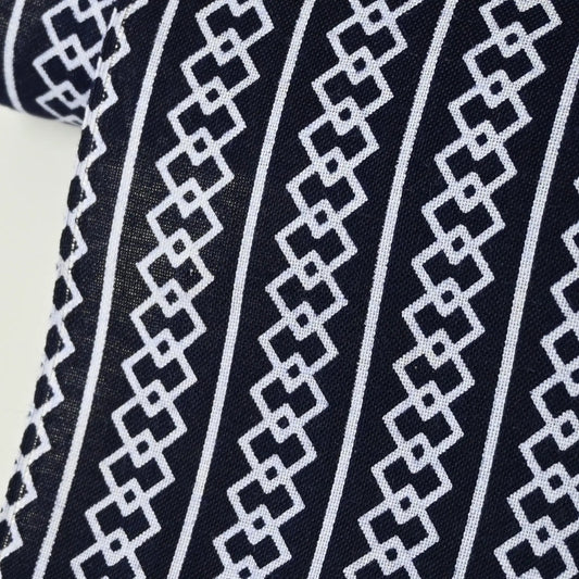 Close-up view of vintage Japanese men's yukata cotton in deep navy with traditional geometric pattern,  Yoshiwara-tsunagi.