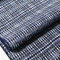 Close-up view of vintage men's yukata cotton fabric with geometric pattern, sold by the metre.