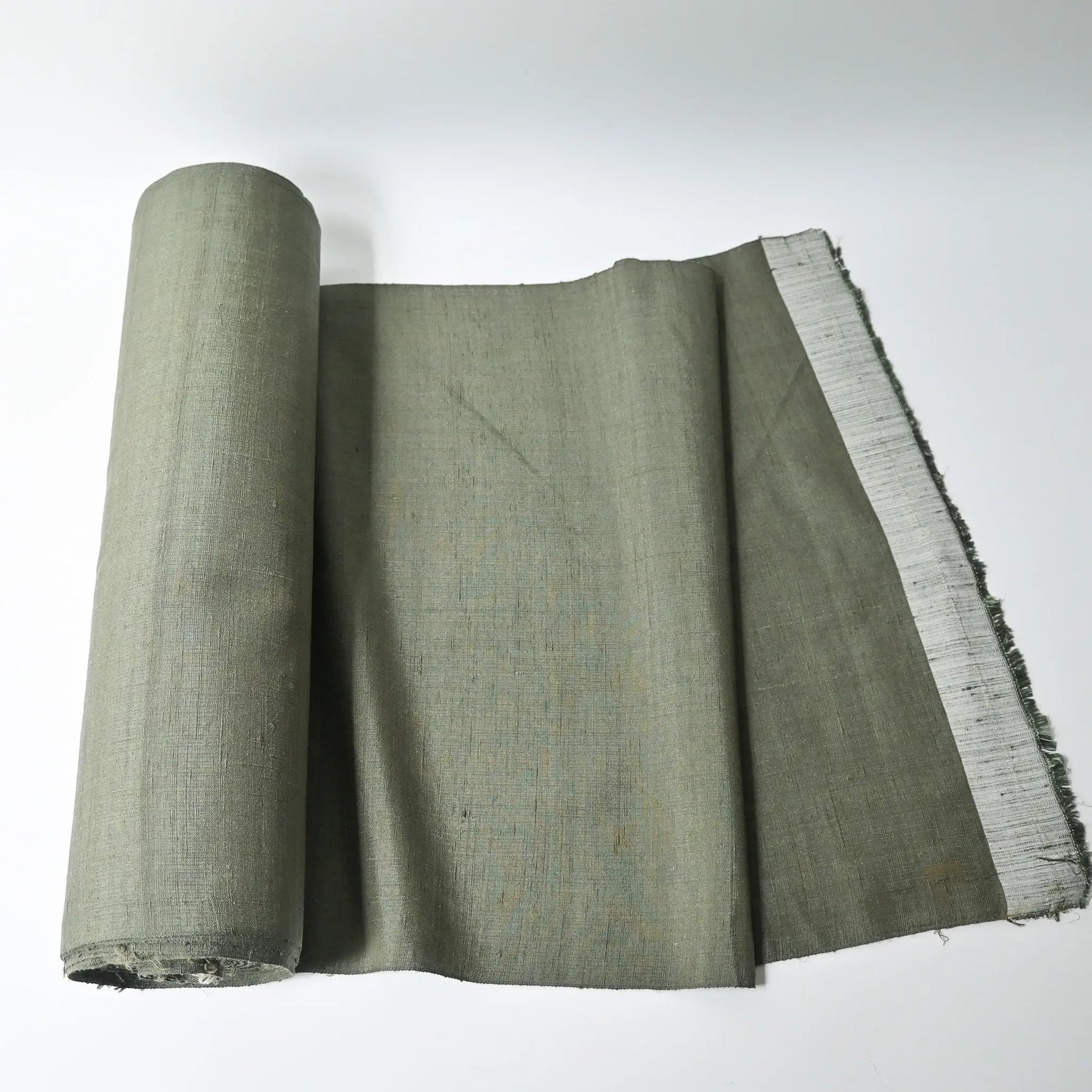 Vintage plain tsumugi silk, men's kimono bolt in moss green, sold by the metre.