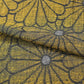 Detailed view of vintage Japanese tsumugi silk kimono fabric with a bold chrysanthemum motif.