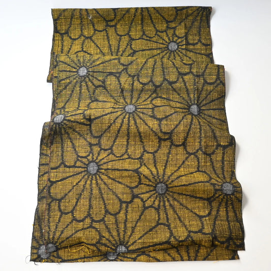 Full view of vintage Japanese tsumugi silk kimono fabric with a bold chrysanthemum motif.