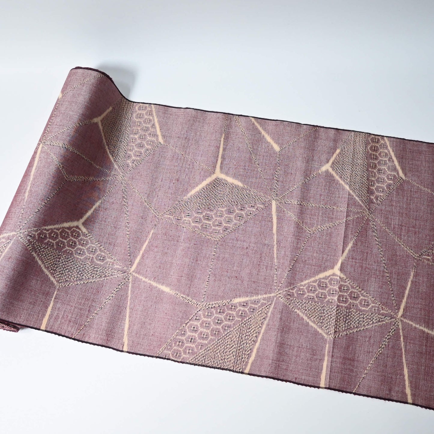 Vintage tsumugi silk kimono fabric in muted mauve tone with a large-scale asanoha motif.