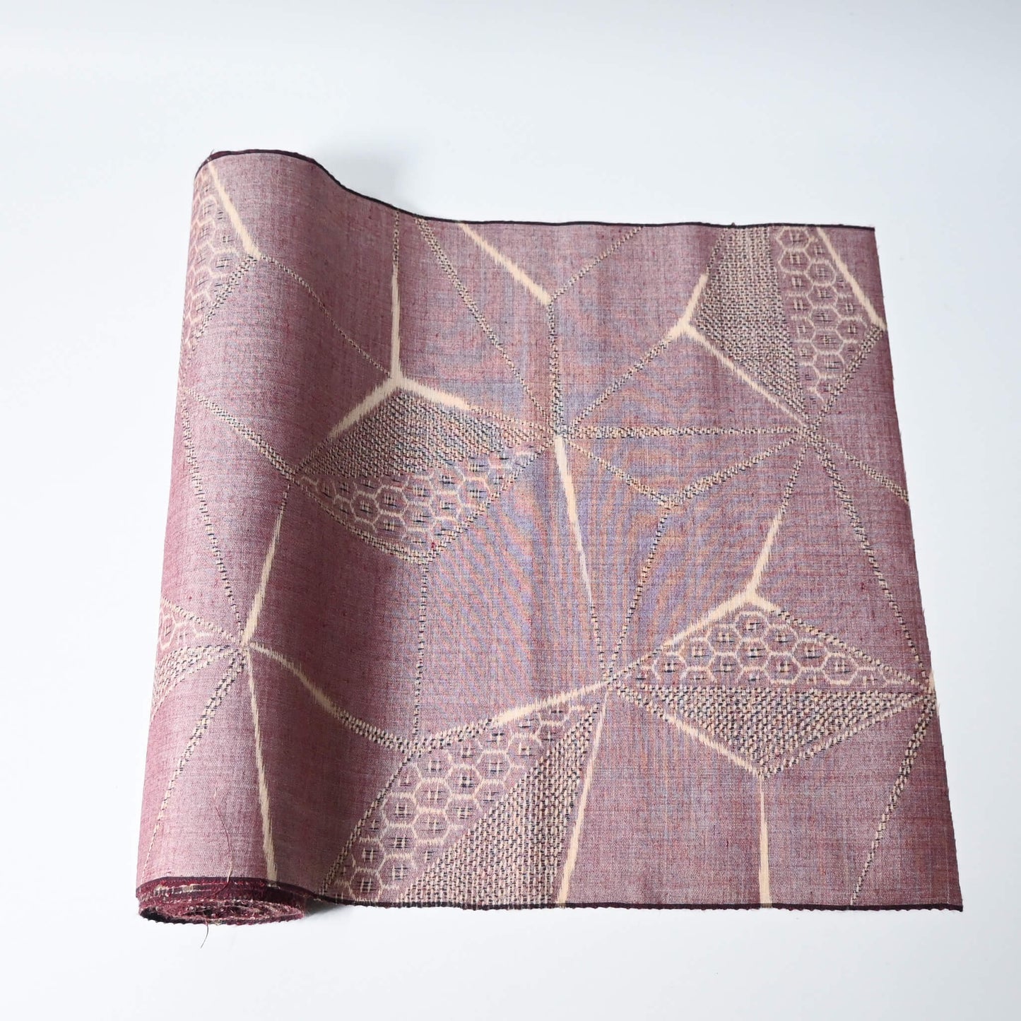 Vintage tsumugi silk kimono fabric in muted mauve tone with a large-scale asanoha motif.