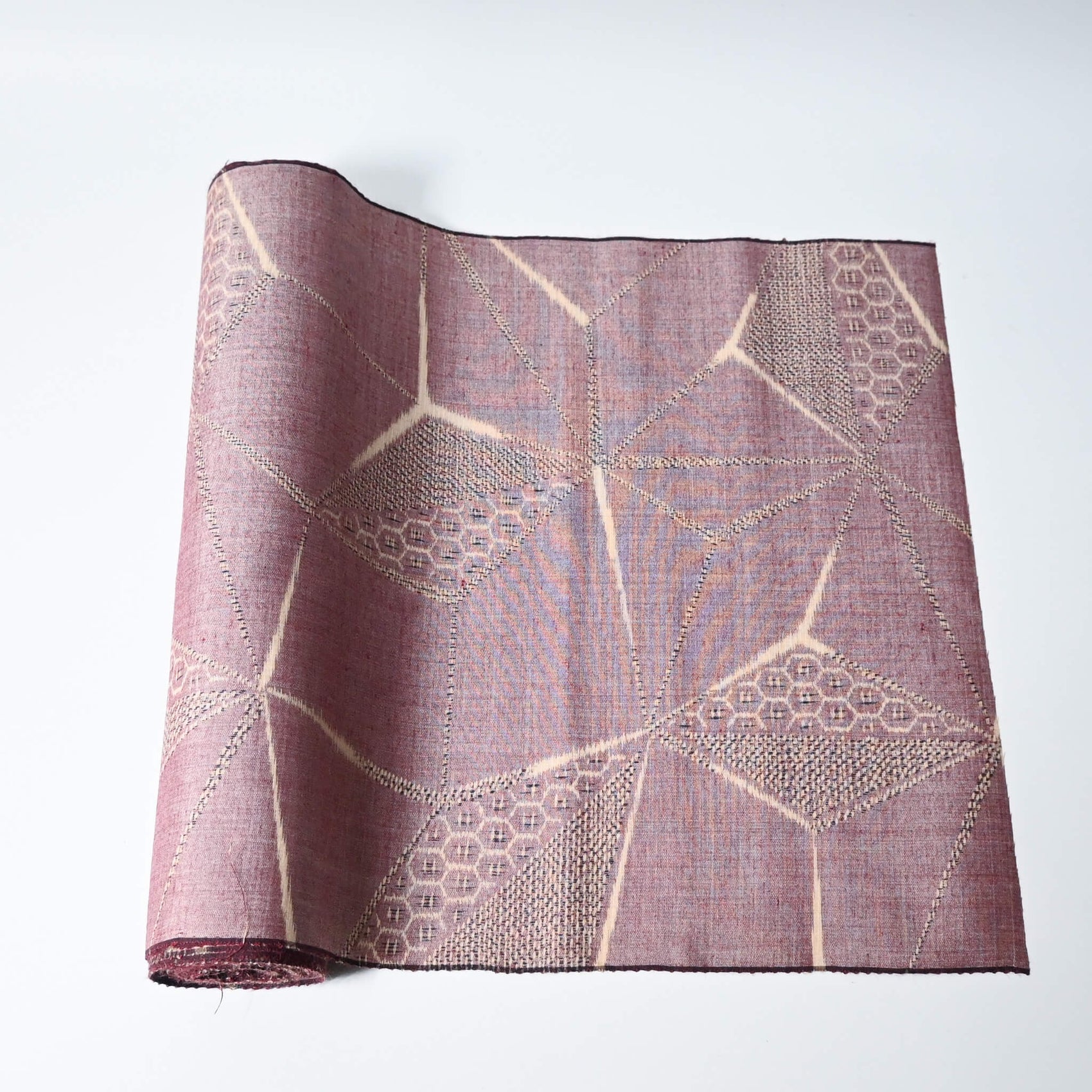 Vintage tsumugi silk kimono fabric in muted mauve tone with a large-scale asanoha motif.
