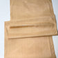 Full view of vintage tsumugi silk kimono fabric piece in a warm, muted yellow tone, gentle sheen.