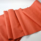 Full view of vintage hand-spun tsumugi silk kimono fabric naturally dyed with safflower, sold by the metre.