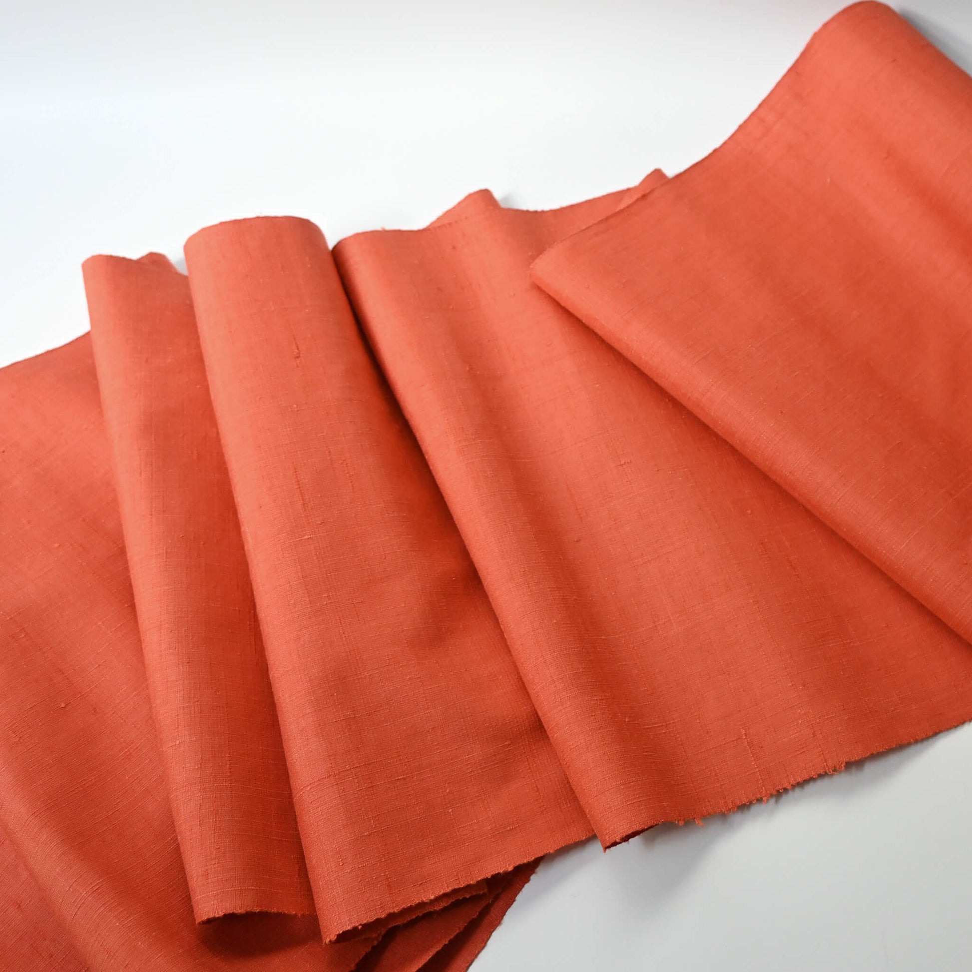 Full view of vintage hand-spun tsumugi silk kimono fabric naturally dyed with safflower, sold by the metre.