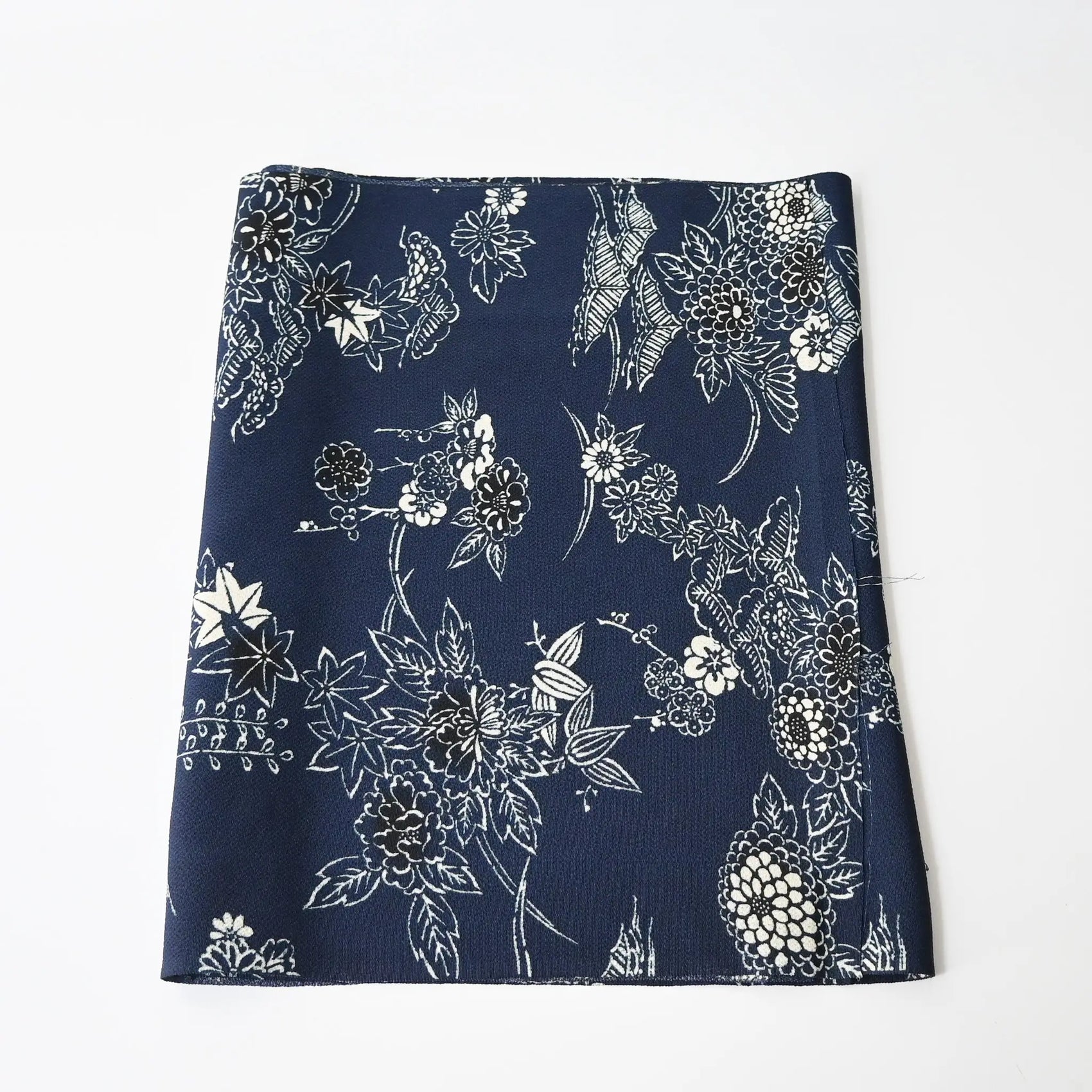 Vintage Chirimen  silk crepe kimono fabric in navy with traditional Japanese seasonal flowers and trees.