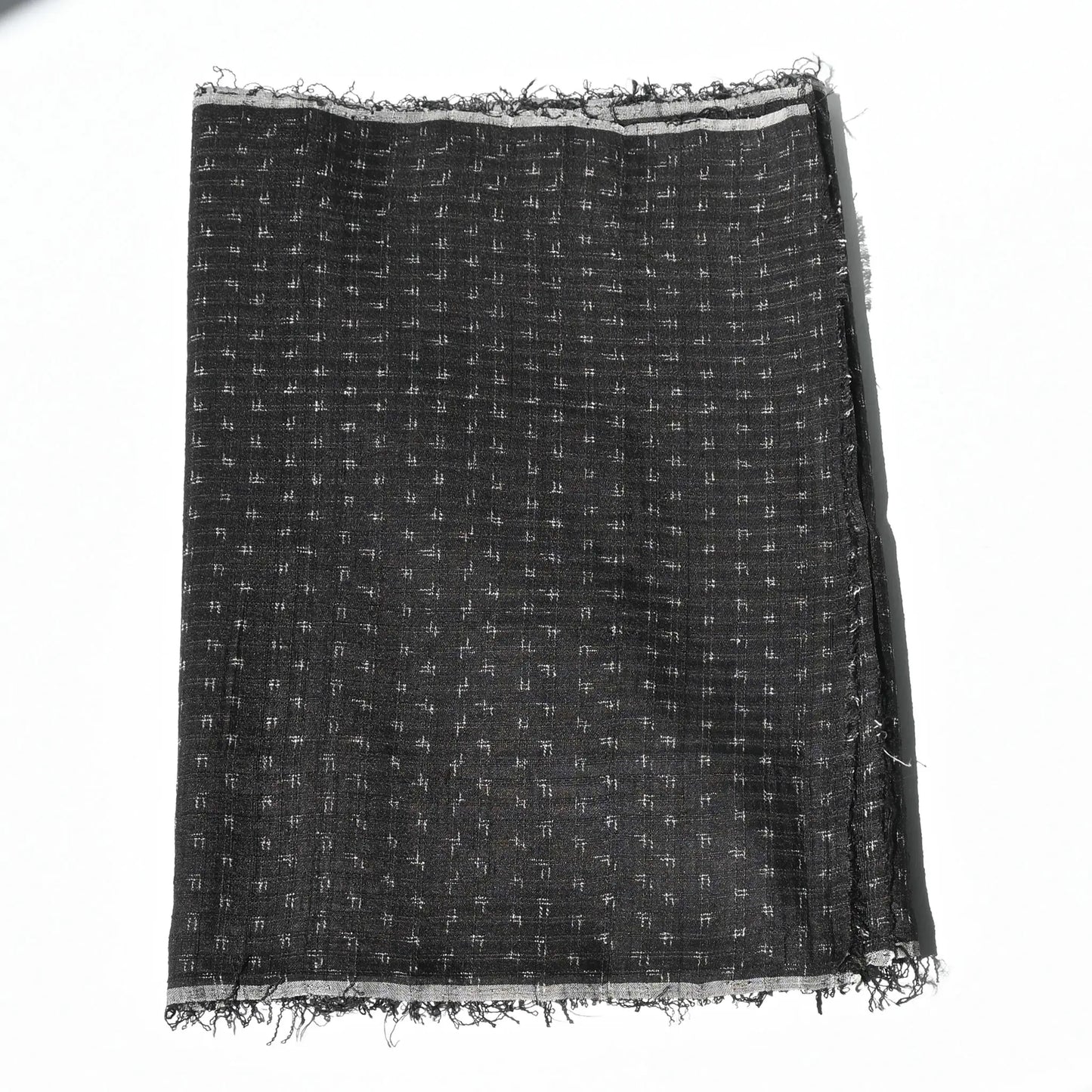 Vintage silk kimono in dark navy with small kasuri woven pattern from the mid-20th century.