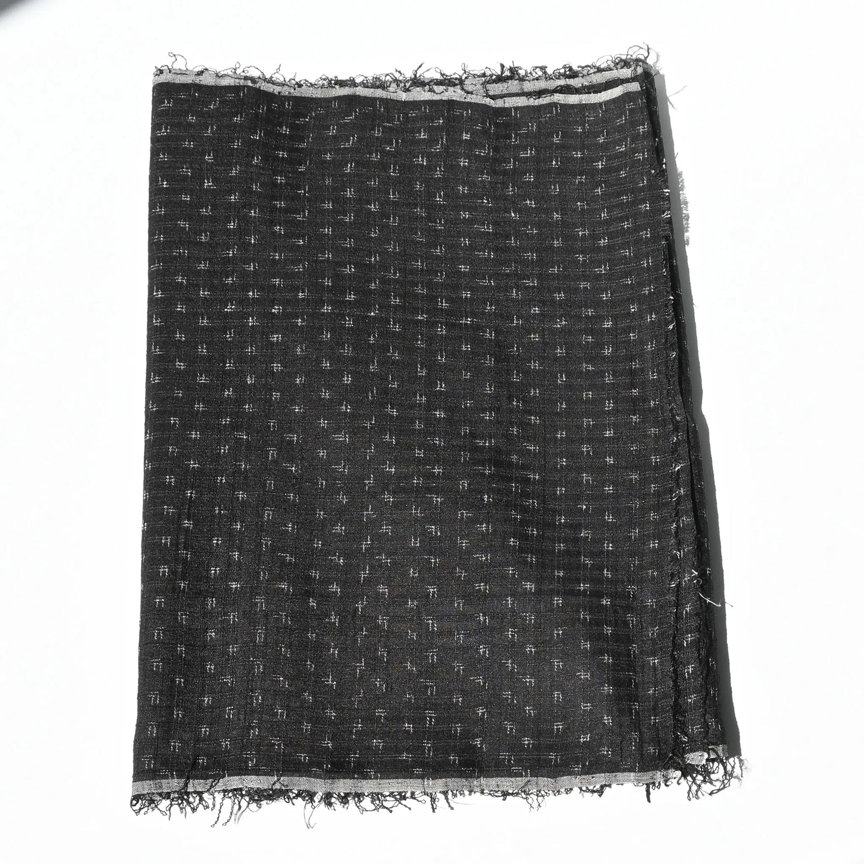 Vintage silk kimono in dark navy with small kasuri woven pattern from the mid-20th century.