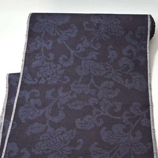 Full view of vintage navy tsumugi silk kimono fabric with peony foliage pattern, sold by the metre.
