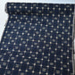 Full view of vintage navy tsumugi silk kimono fabric with woven kasuri pattern.