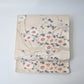 Vintage women's off-white silk fukuro obi with elegant plum blossom motif.