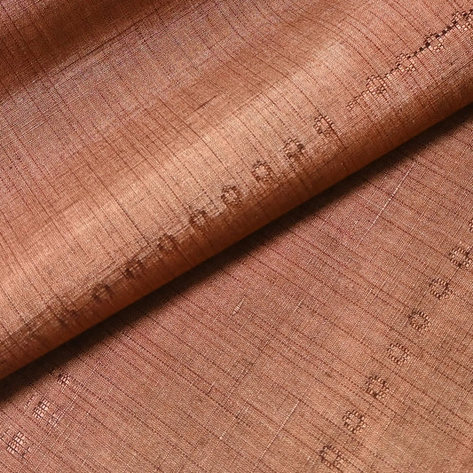 Detailed view of vintage pink brown tsumugi silk kimono fabric roll sold by the metre.