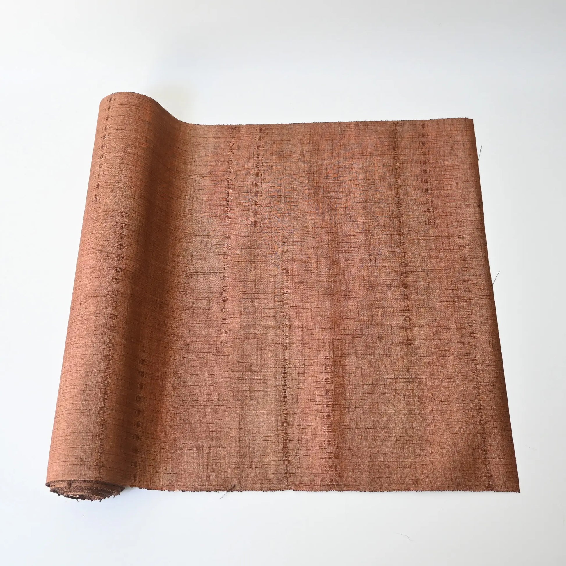 Vintage pink brown tsumugi silk kimono fabric roll sold by the metre.