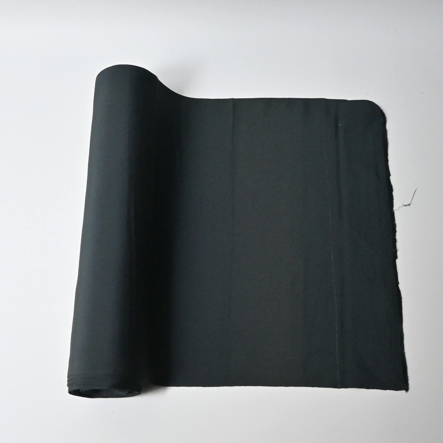 Vintage plain silk crepe kimono fabric roll in deep green, sold by the metre.