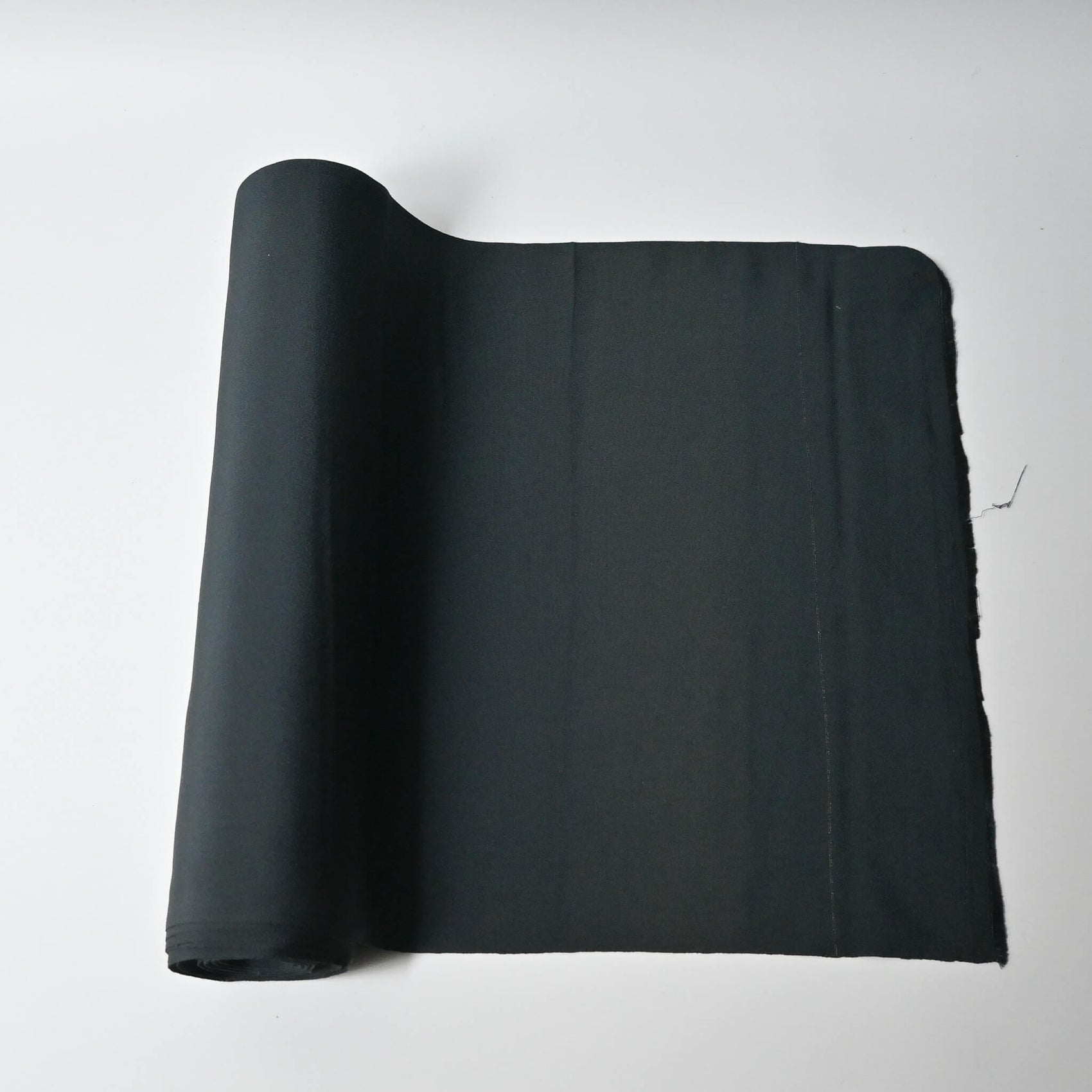 Vintage plain silk crepe kimono fabric roll in deep green, sold by the metre.