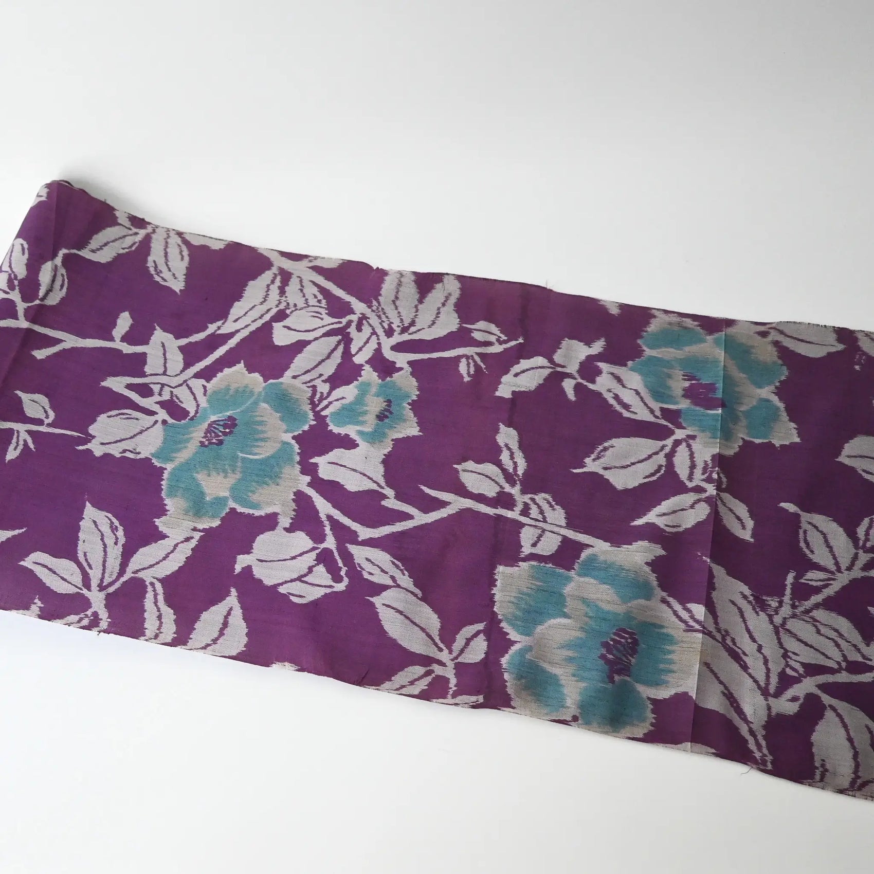 Full view of vintage Japanese purple Meisen silk kimono fabric with turquoise peony motif.