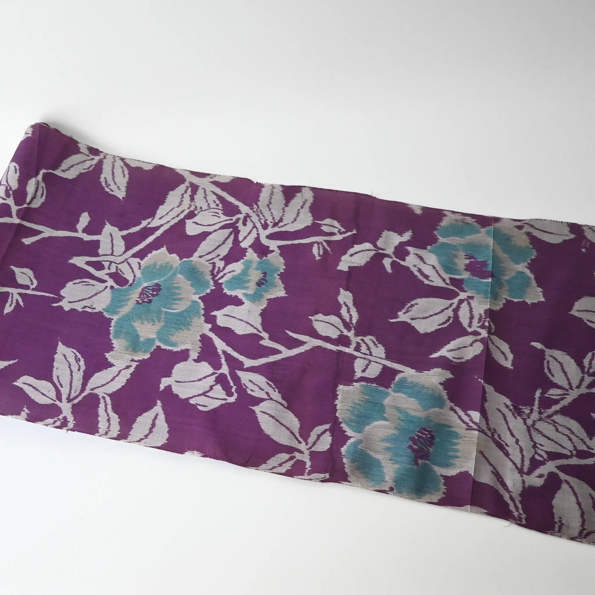 Full view of vintage Japanese purple Meisen silk kimono fabric with turquoise peony motif.