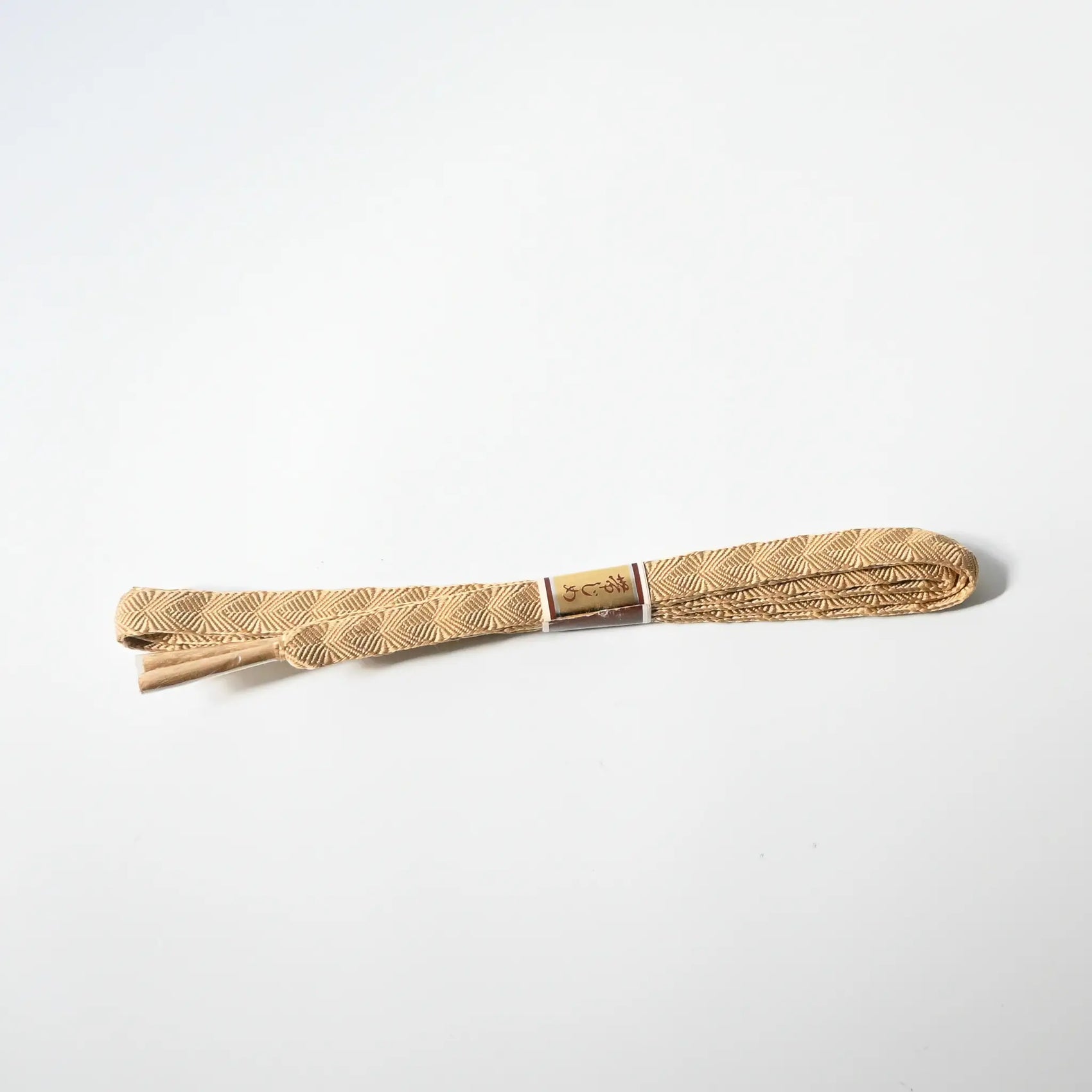 Vintage Japanese Kumihimo braided silk Obijime in soft beige.