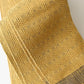 Close-up view of vintage Japanese men's silk Kaku Obi with woven design in soft yellow.