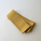 Vintage Japanese men's silk Kaku Obi with woven design in soft yellow.