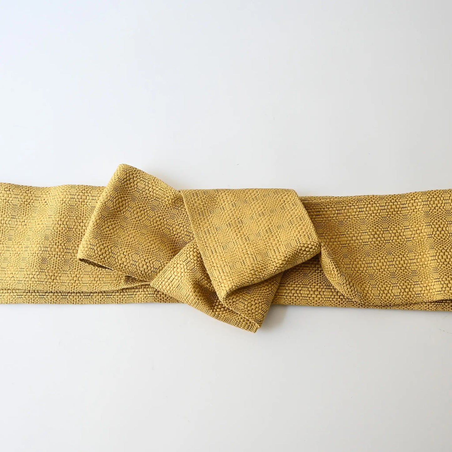 Vintage Japanese men's silk Kaku Obi with woven design in soft yellow.