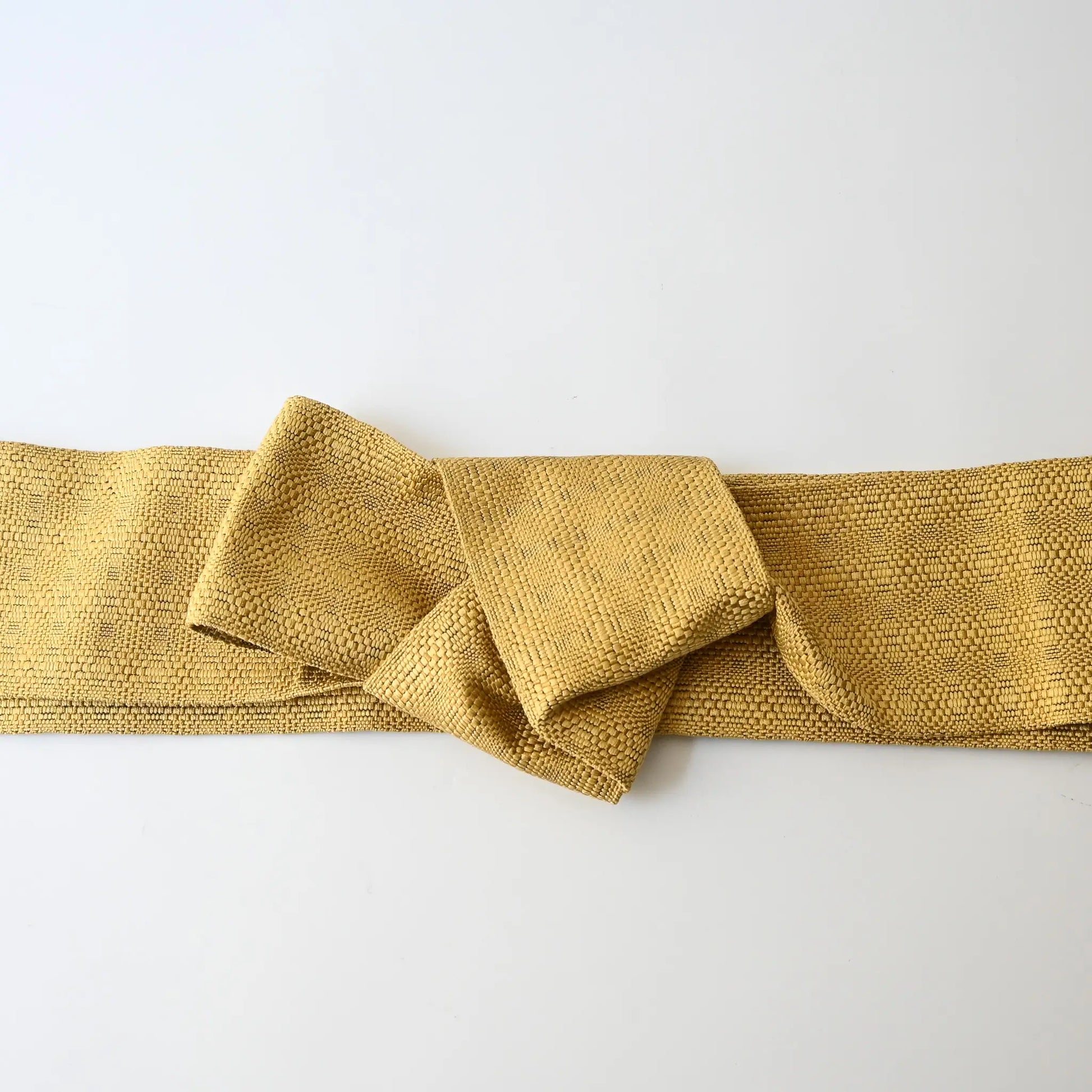 Vintage Japanese men's silk Kaku Obi with woven design in soft yellow.