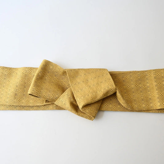 Vintage Japanese men's silk Kaku Obi with woven design in soft yellow.
