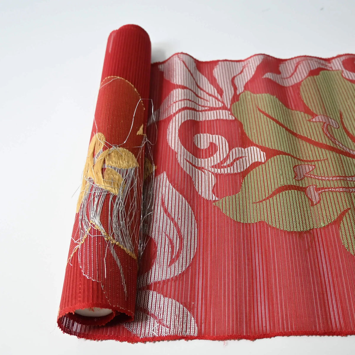 Back of the material with thinly cut silver coated threads woven in.