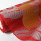 Detailed view of vintage Japanese red ro silk obi fabric, silver threads.