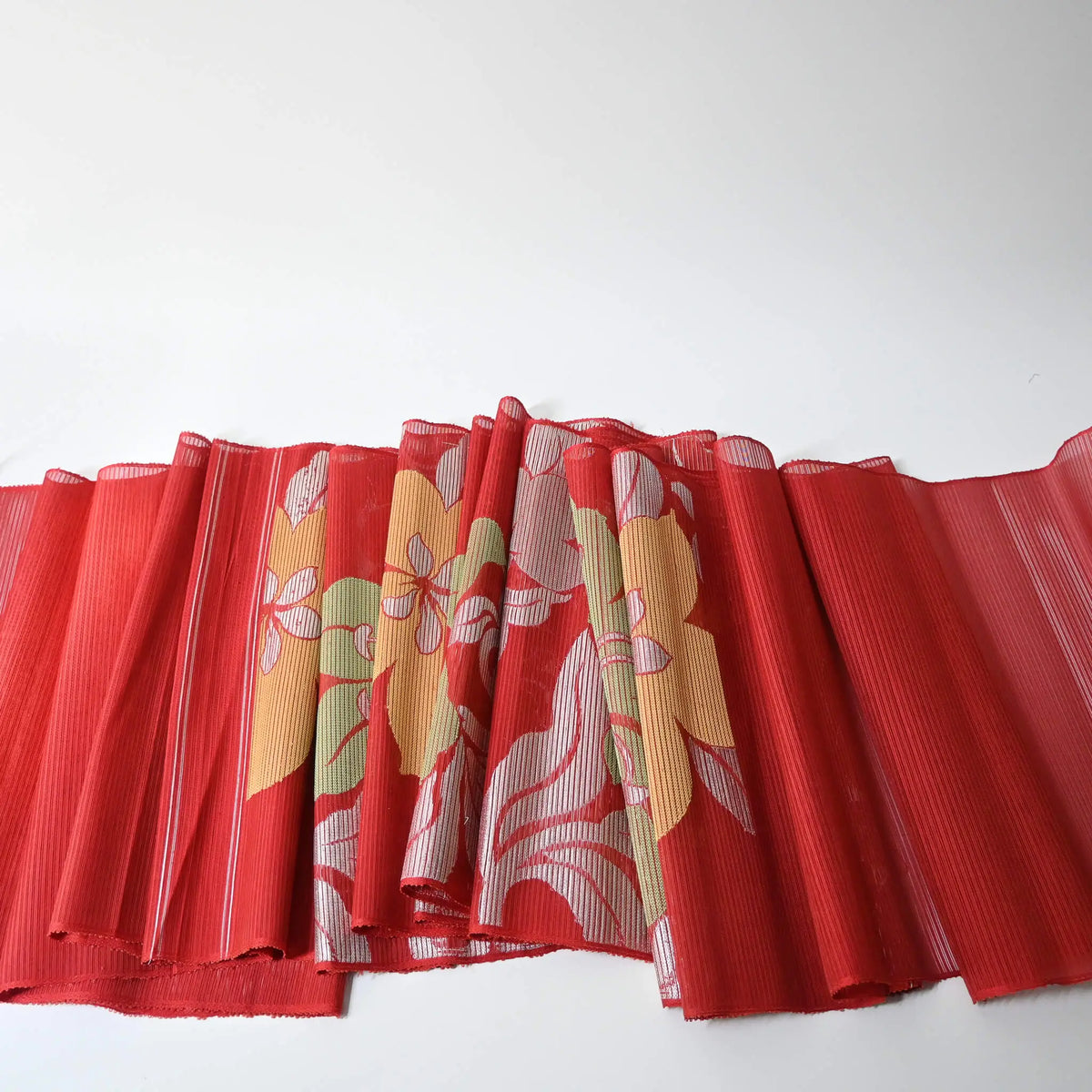 Entire view of vintage Japanese red ro silk obi fabric.
