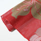 Detailed view of vintage Japanese red ro silk obi fabric, open weave.