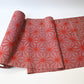 Vintage wool kimono fabric in red with bold asanoha motif, sold by the metre.
