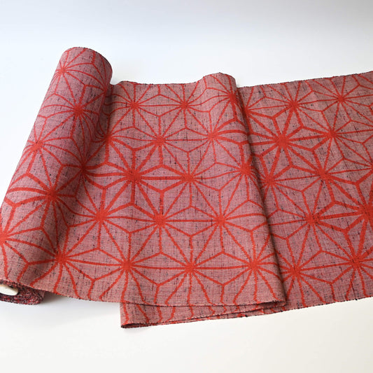 Vintage wool kimono fabric in red with bold asanoha motif, sold by the metre.