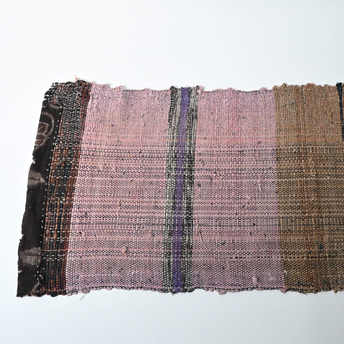 A section of vintage Sakiori fragment cloth from Tohoku region, woven from shredded strips of recycled kimono and futon covers.