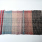 A section of vintage Sakiori fragment cloth from Tohoku region, woven from shredded strips of recycled kimono and futon covers.