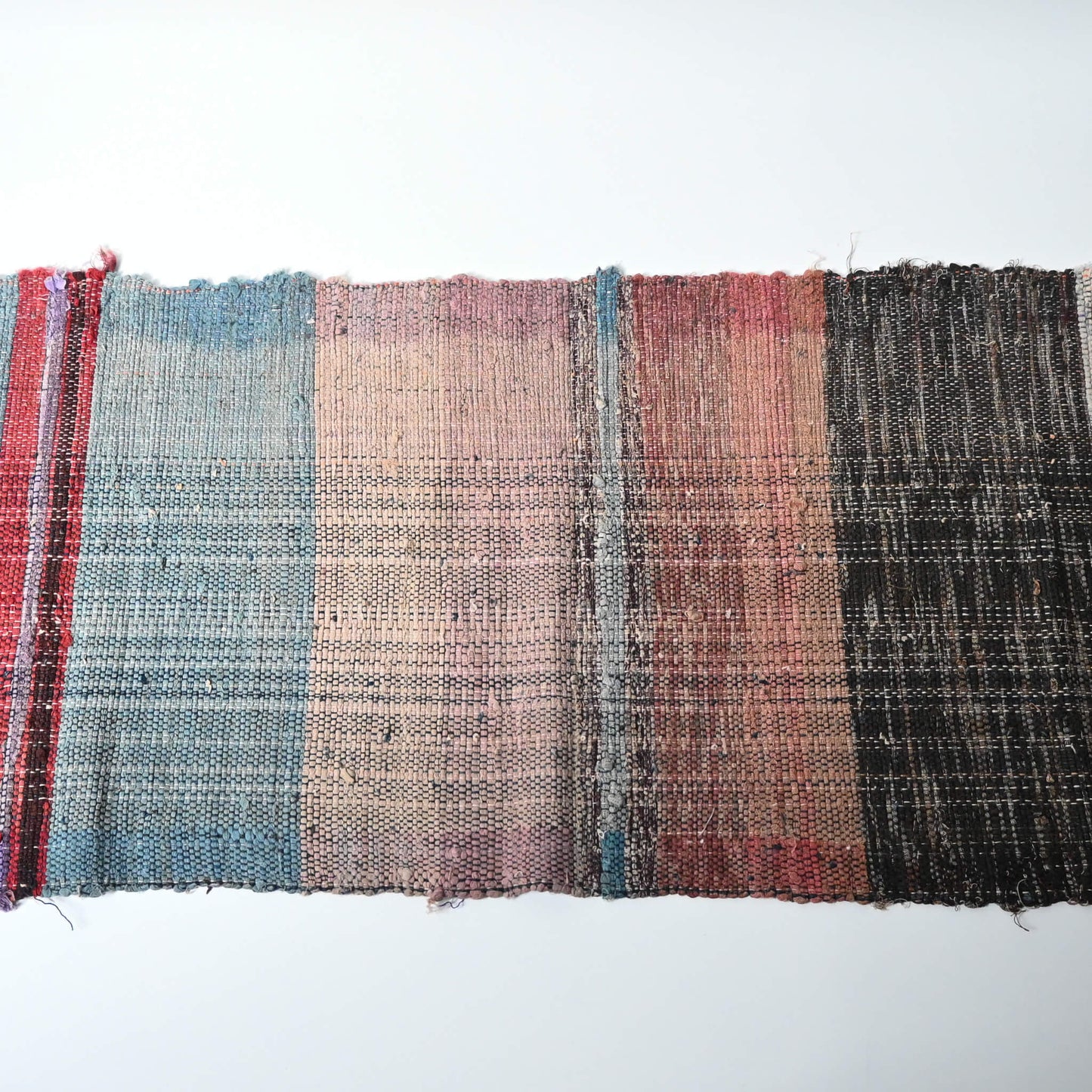 A section of vintage Sakiori fragment cloth from Tohoku region, woven from shredded strips of recycled kimono and futon covers.
