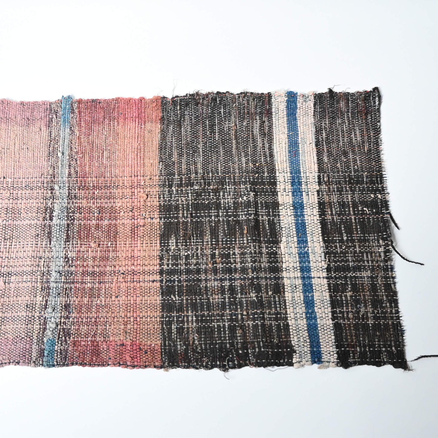 A section of vintage Sakiori fragment cloth from Tohoku region, woven from shredded strips of recycled kimono and futon covers.
